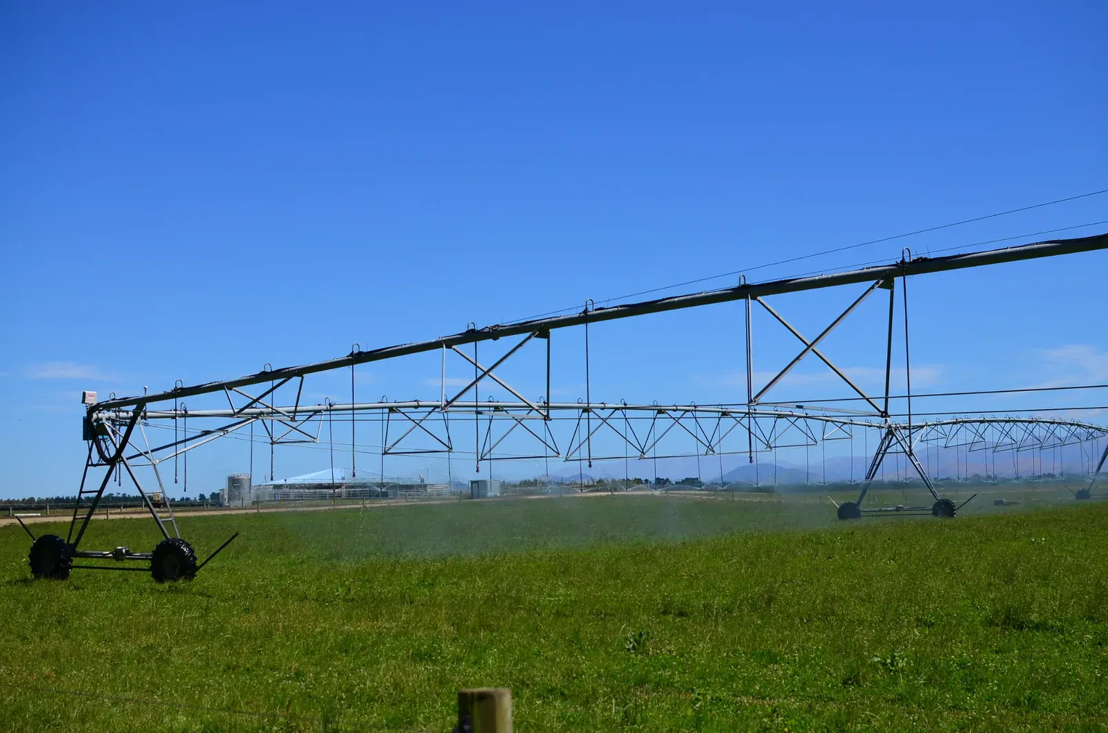 A centre-pivot irrigator operating on Canterbury farmland.